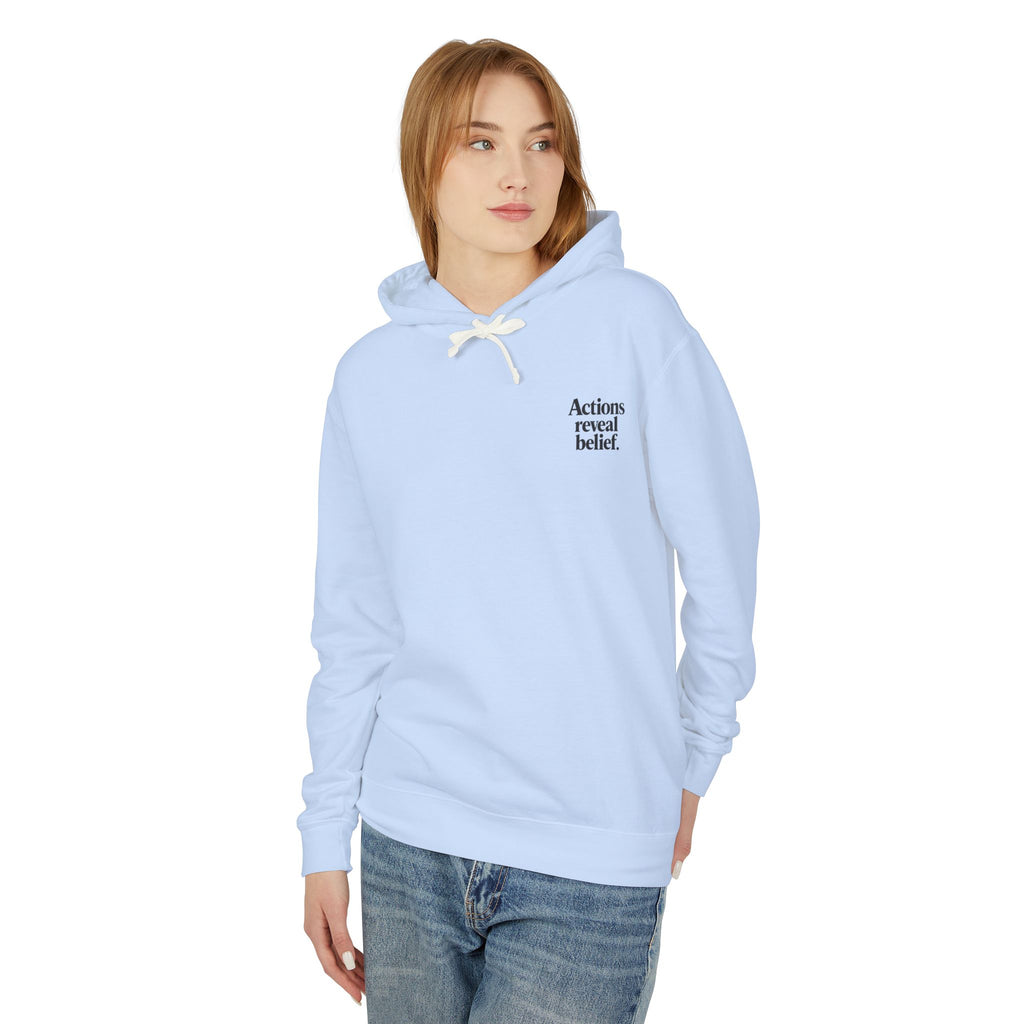Person wearing a light blue hoodie with text on a white background