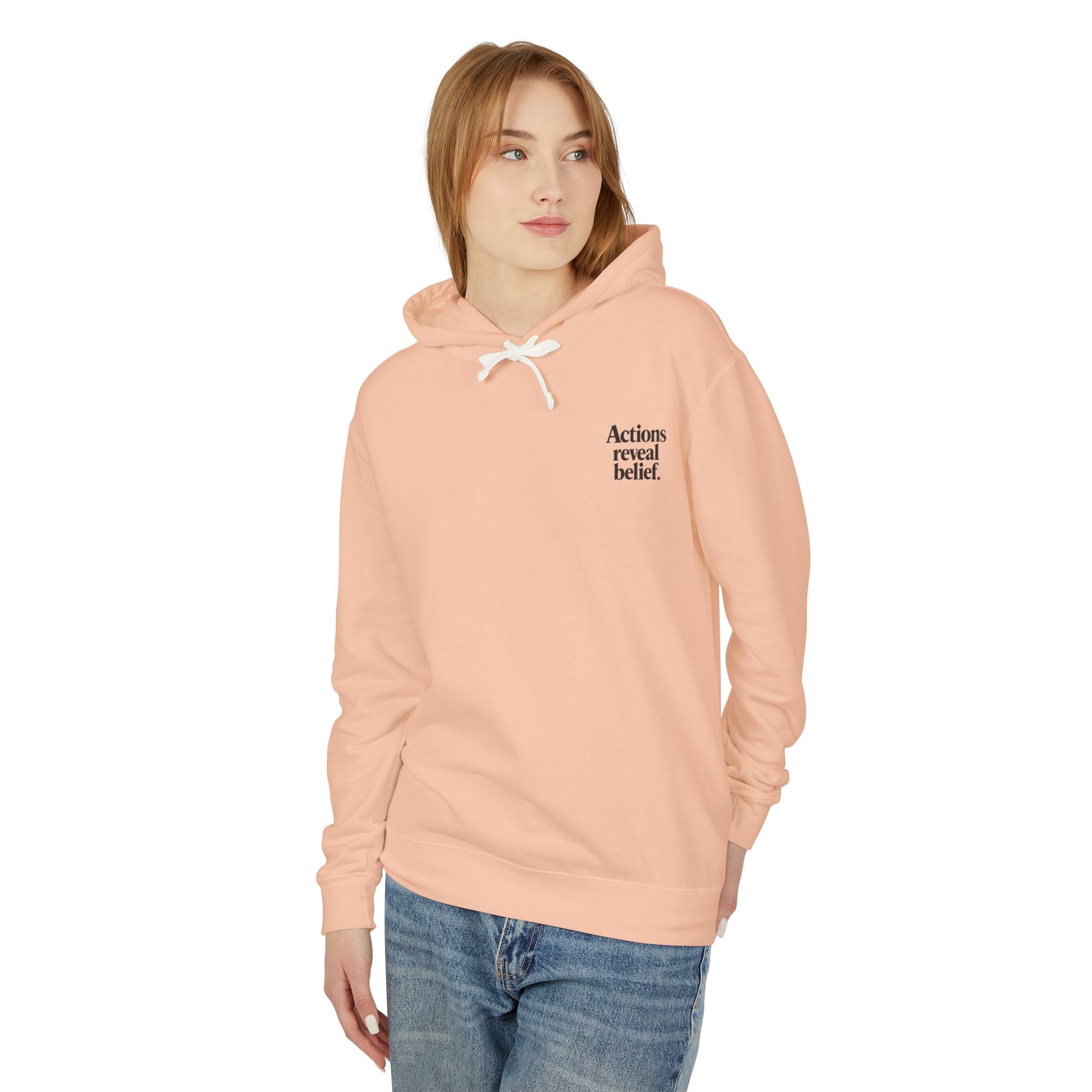 Person wearing a peach hoodie with text on a white background