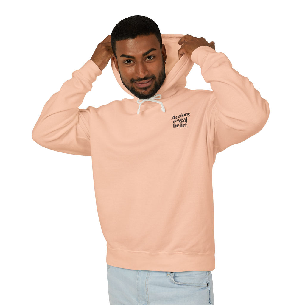 Man wearing a peach hoodie with text on a white background
